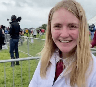 Photo of a show ground and a girl in a white coat